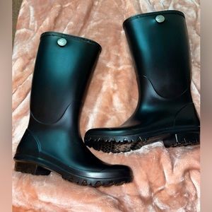 Woman UGG rain boots. Never worn. Size 9 all black.